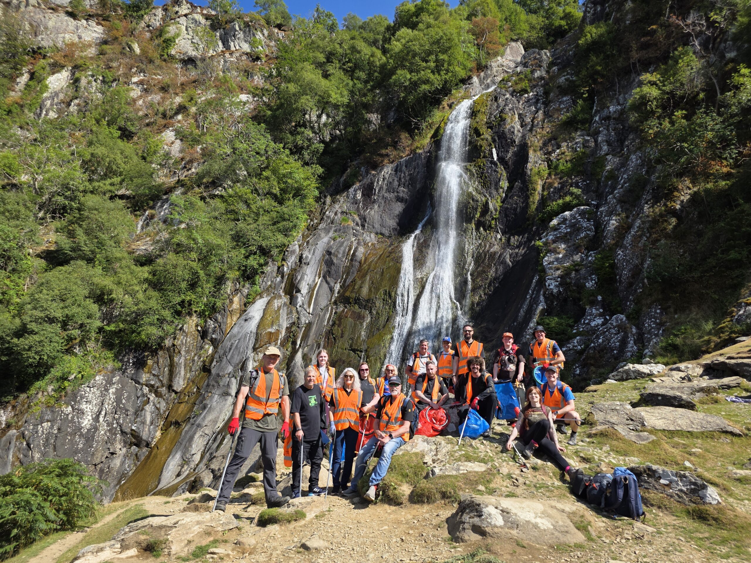 ReAgent Foundation team members in front of a waterfall in Snowdonia National Park